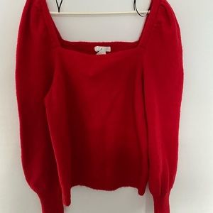 Puff-sleeved sweater.